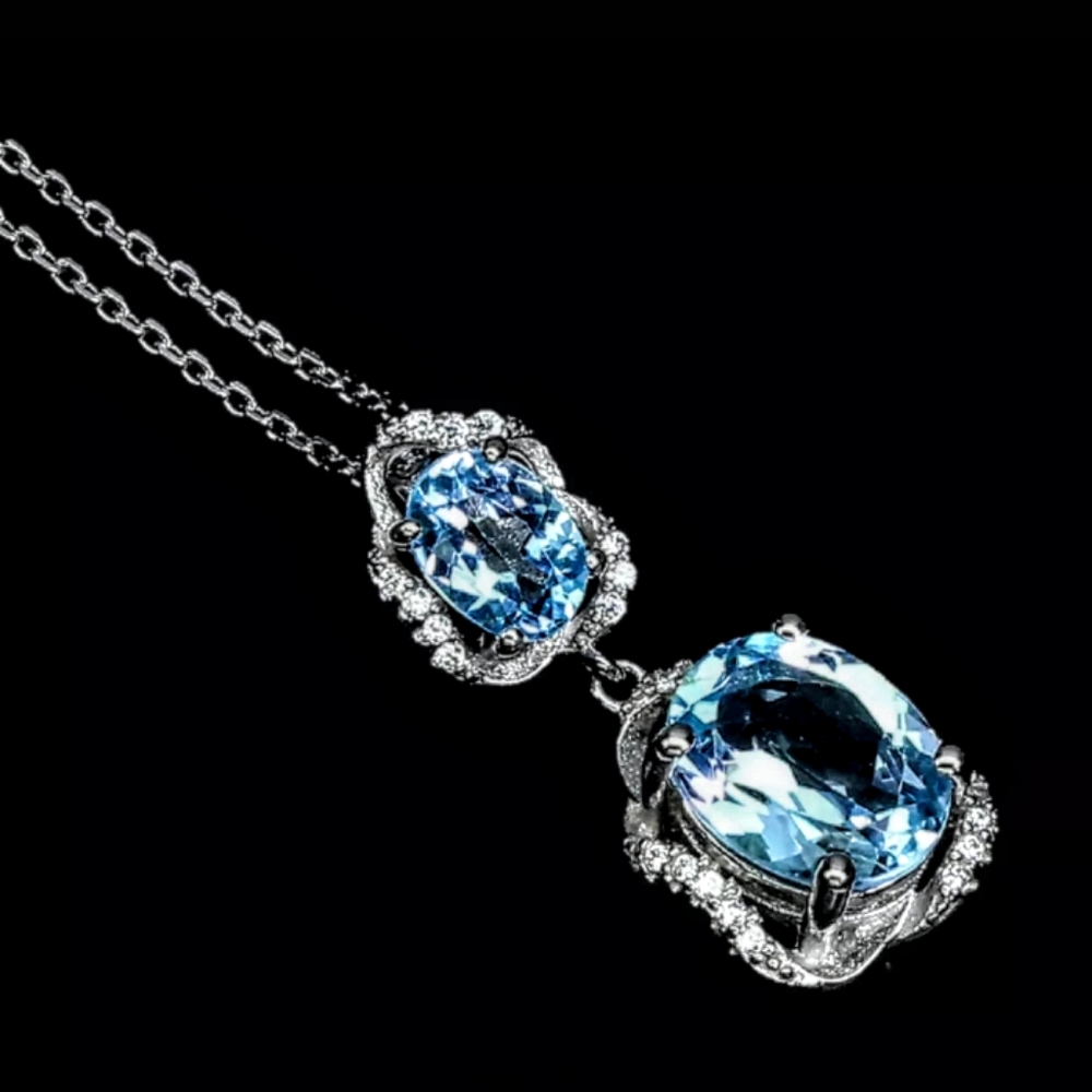 Sky Blue Topaz 14K over 925 Pendant with Chain.